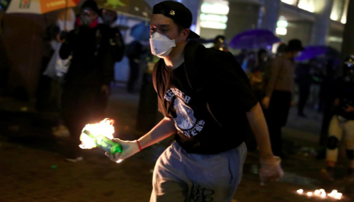 Hong Kong protesters confront police to try to free campus allies