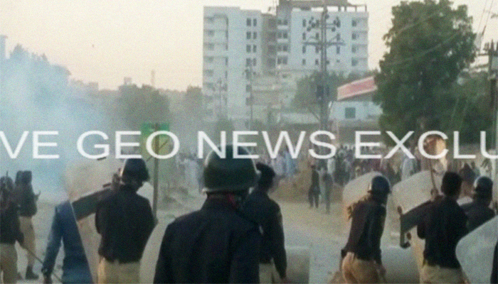 Police fire tear gas as people protest anti-encroachment operation in Karachi