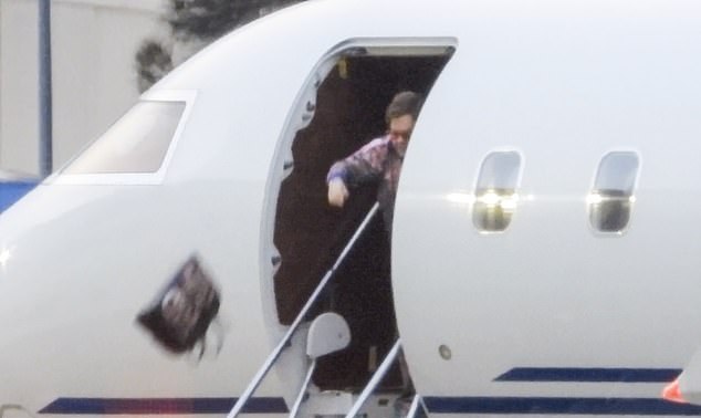 Elton John’s airport moment has him throwing $4000 Gucci bag off a runway