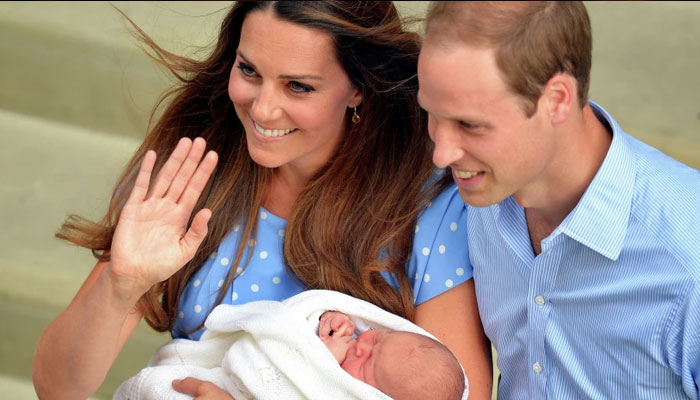 Prince William and Kate Middleton pose for a picture with their firstborn son George. — Reuters/File