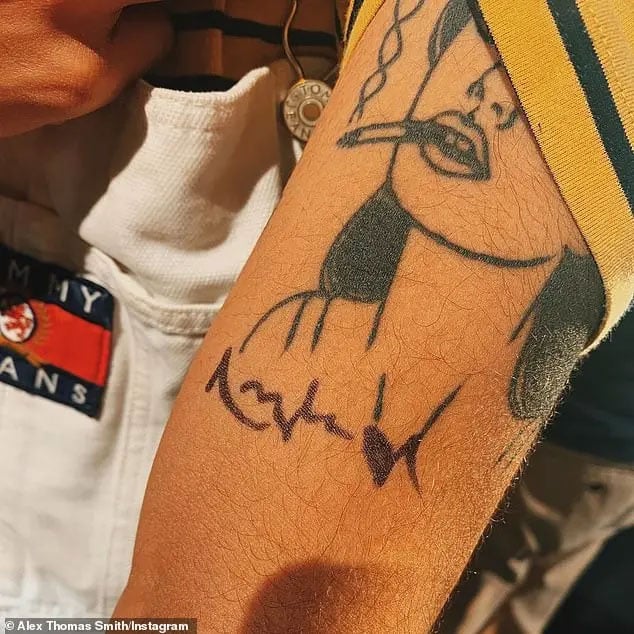 Angelina Jolie signs a tattoo of her own face on a British actor’s arm