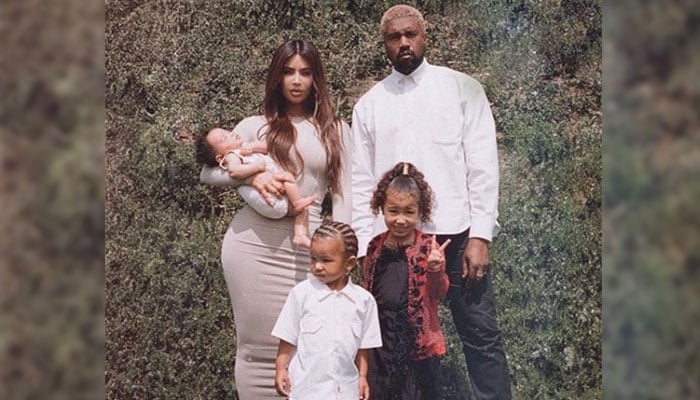 Why did Kim Kardashian choose a Christmas card with her kids in 2019?