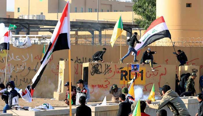 Iraqi militiamen hurl stones at US Embassy, prepare for extended stay
