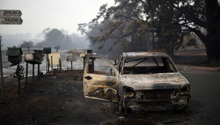 Australia firefighters race to contain blazes as heatwave looms