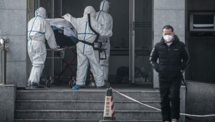 China says virus spreading between humans as WHO set to meet