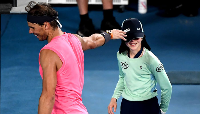 Rafael Nadal apologises to ballgirl with kiss on cheek after a shot hits her