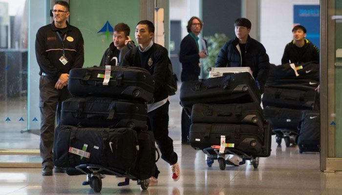 Football team from virus-hit China city arrive in Spain 