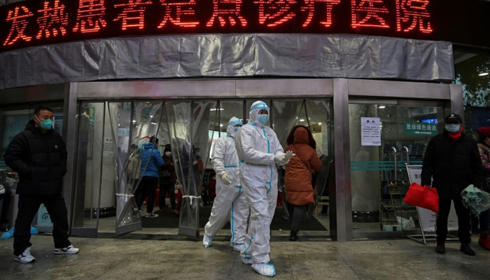 China locks down yet another city as first virus death abroad reported