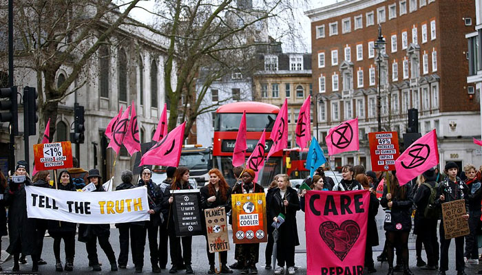 Extinction Rebellion activists protest against London Fashion Week