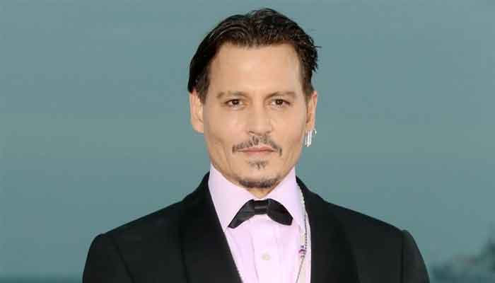 Johnny Depp plays a troubled genius in 'Minamata'