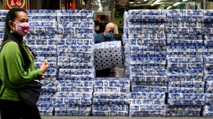 Panic buying follows coronavirus across the globe despite calls for calm