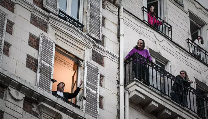 Balcony music stars bring joy to their daily audience in France amid isolation 