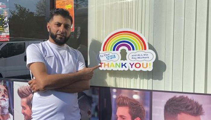 British-Pakistani barber raises money for NHS by selling rainbow stickers
