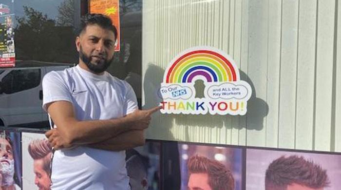 British-Pakistani barber raises money for NHS by selling rainbow stickers