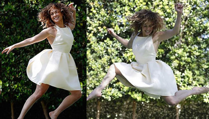 Jennifer Lopez dazzles in the air wearing chic white dress