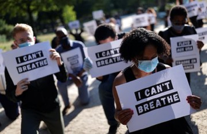 People protest against the death in Minneapolis police custody of George Floyd next to the U.S. embassy in Paris France