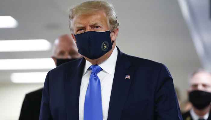 In a first, Trump covers face with mask in public as coronavirus cases surge in US