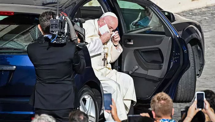 Pope Francis wears a face mask for the first time in public