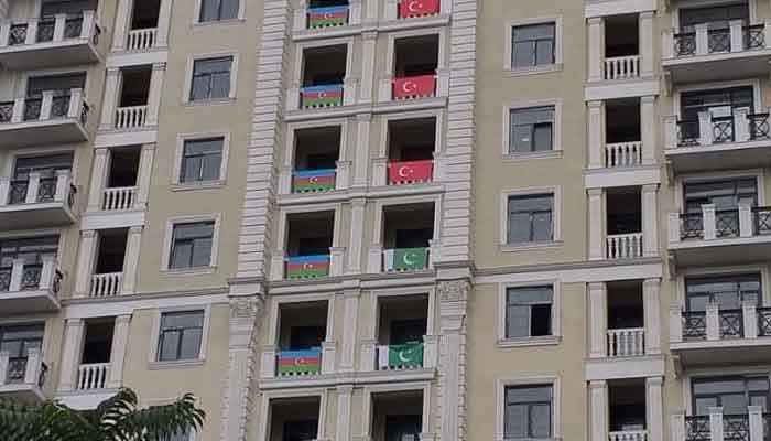 Azerbaijanis display flags of Pakistan and Turkey in Baku