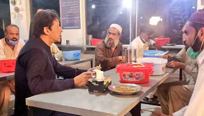 Watch: PM Imran Khan breaks bread with Islamabad Panahgah residents