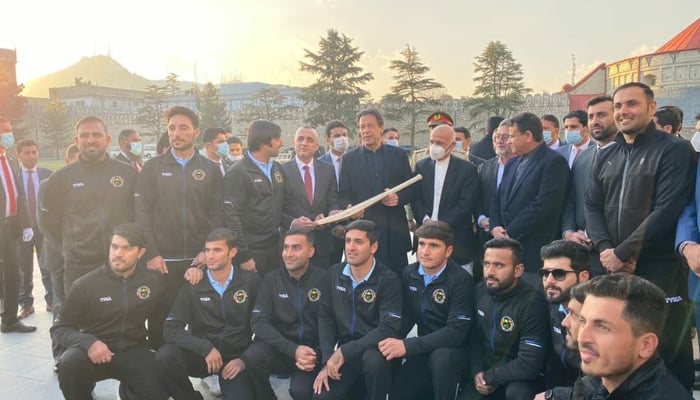 Maiden Kabul visit: Afghan cricket team presents PM Imran Khan a signed bat