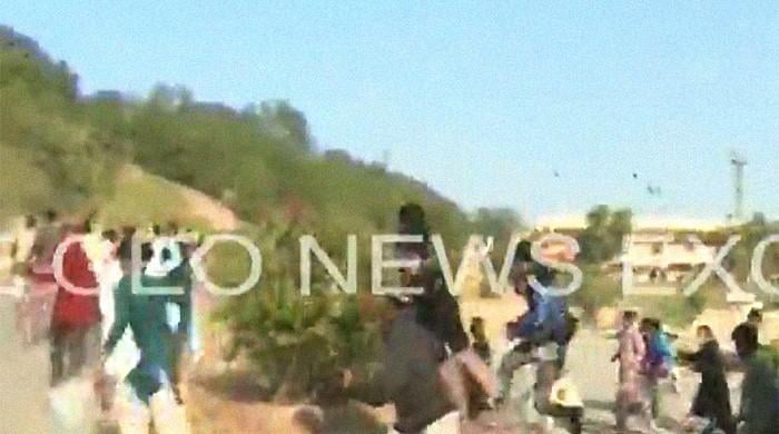 WATCH: PDM workers break through barriers at Multan rally venue