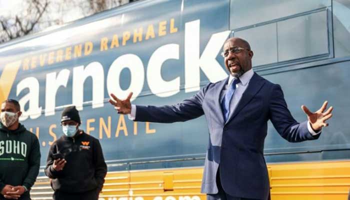 Raphael Warnock wins one Georgia runoff as Democrats inch closer to taking control of US Senate