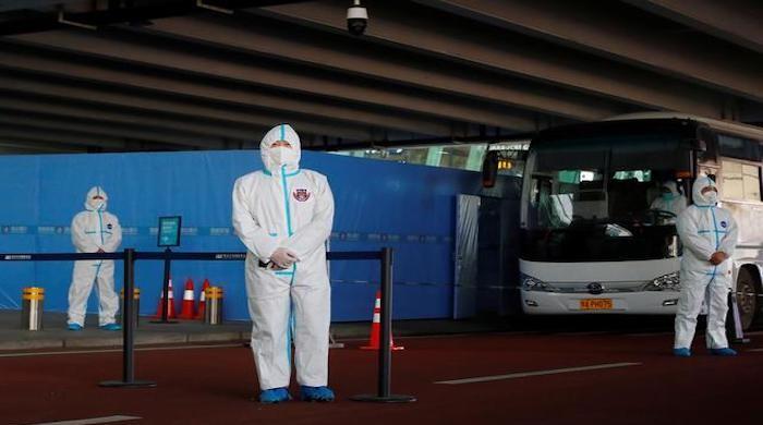 Two WHO members barred from entering China after testing positive for coronavirus