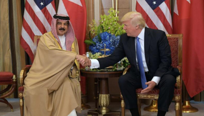 On last full day in office, Trump decorates Bahrain king with rare award