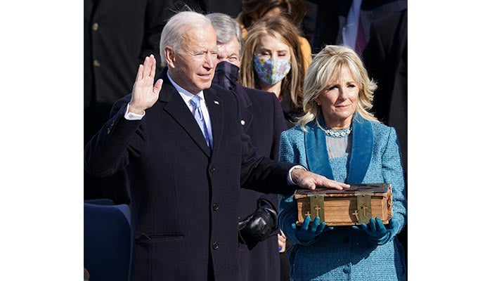 Joe Biden is sworn in as the 46th President of the United States as his spouse Jill Biden holds a bible on the West Front of the U.S. Capitol in Washington, U.S., January 20, 2021. — Reuters
