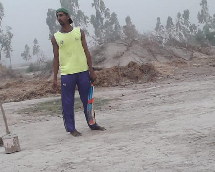 Shahnawaz Dahani playing cricket barefoot at his village in Larkana.