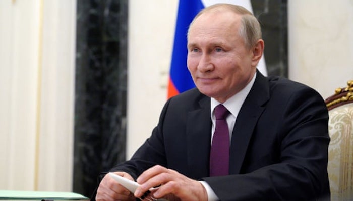 Russian President Vladimir Putin signs law that could keep him in Kremlin until 2036