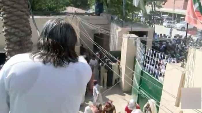 Watch: Hundreds gather outside Ali Amin Gandapur's residence for free rations