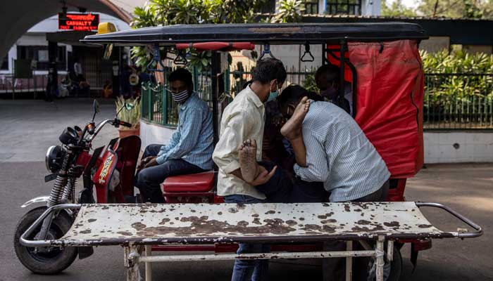 ‘The system is broken’: COVID patients die on trolleys outside Delhi hospital