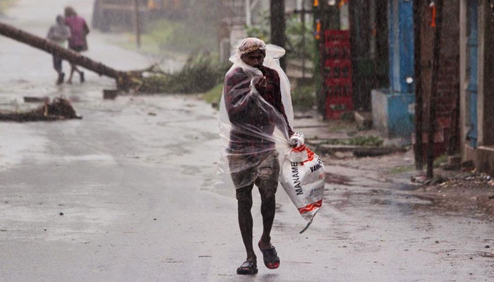 33 dead, dozens missing as cyclone batters Covid-stricken India