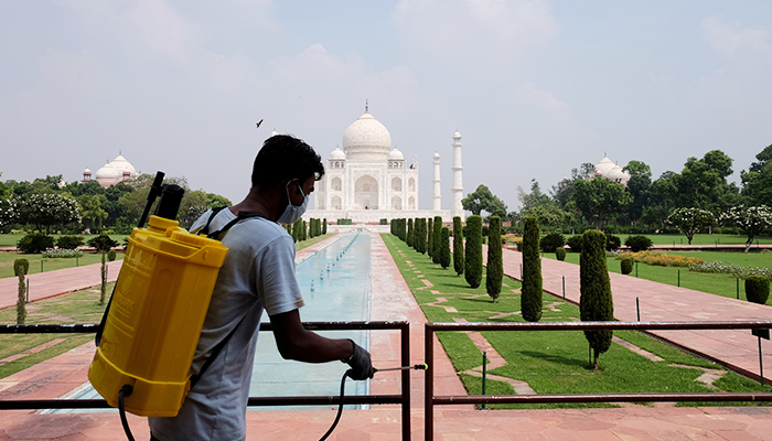 A man sanitizes railings in the premises of Taj Mahal after authorities reopened the monument to visitors, amidst the coronavirus disease (COVID-19) outbreak, in Agra, India, September 21, 2020. — Reuters/File