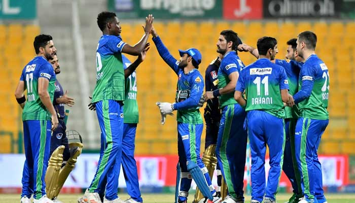 Multan Sultans players celebrate after taking a wicket against Quetta Gladiators at Abu Dhabis Sheikh Zayed Cricket Stadium, on June 16, 2021.
