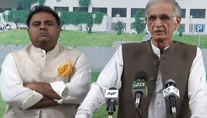 Defence Minister Pervez Khattak (right) addressing a press conference along with Federal Information Minister Fawad Chaudhry (left) in Islamabad, on June 17, 2021. — YouTube