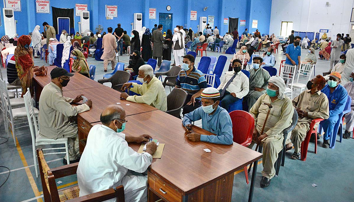 Senior citizens getting themselves registered to receive the coronavirus jab at a vaccination centre in Faisalabad, on June 1, 2021. — APP/File