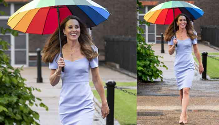 Kate Middleton looks elegant in pale blue dress with colorful umbrella as rain pours down around her