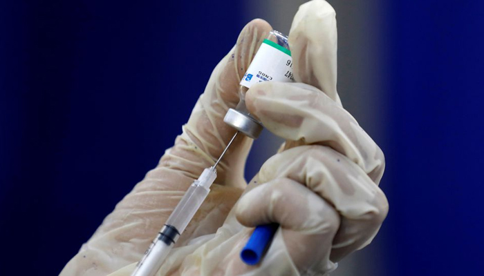 A paramedic prepares a dose of Sinopharms coronavirus disease (COVID-19) vaccine before administering it to a resident, at a vaccination center in Karachi, Pakistan March 22, 2021. — Reuters/File