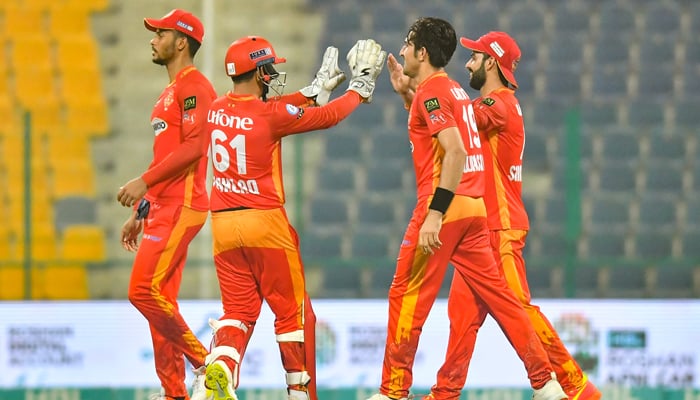 Islamabad United players celebrate after dismissing a Multan Sultans batsman at Sheikh Zayed Cricket Stadium in Abu Dhabi. Photo: PSL