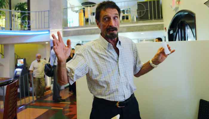 In this file photo taken on December 13, 2012, John McAfee talks to the media at the Beacon Hotel where he was staying after arriving a night ago from Guatemala. — Joe Raedle/AFP