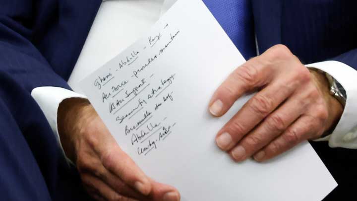US President Joe Biden holds his notes during a meeting with Afghan President Ashraf Ghani and Chairman of Afghanistans High Council for National Reconciliation Abdullah Abdullah at the White House, in Washington, U.S., June 25, 2021. -REUTERS