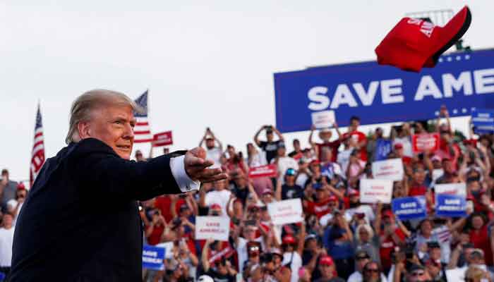 Former US President Donald Trump tosses out a hat during his first post-presidency campaign rally at the Lorain County Fairgrounds in Wellington, Ohio, US, June 26, 2021. Photo: Reuters