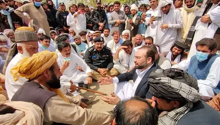 A picture of a KP govt delegation holding talks with Janikhel tribal elders at the Bannu sit-in. The picture is from March. Photo: File