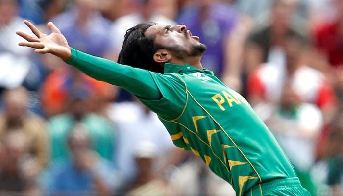 Pakistani right-arm fast bowler Hassan Ali celebrates in his signature style. Photo: Reuters