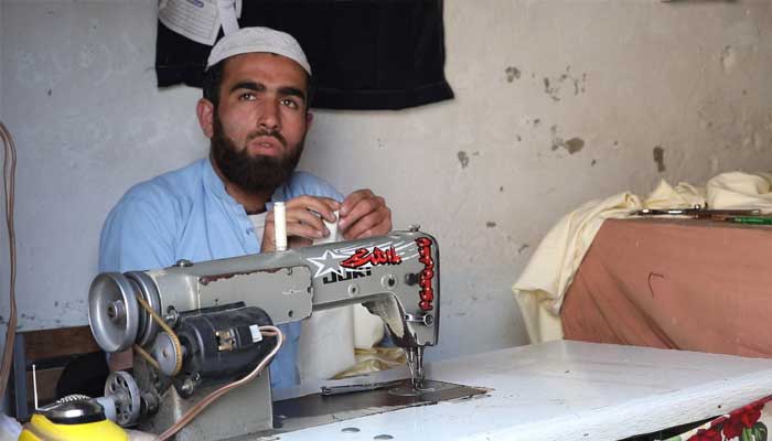 A worker at a tailor shop in tribal area. Photo by author