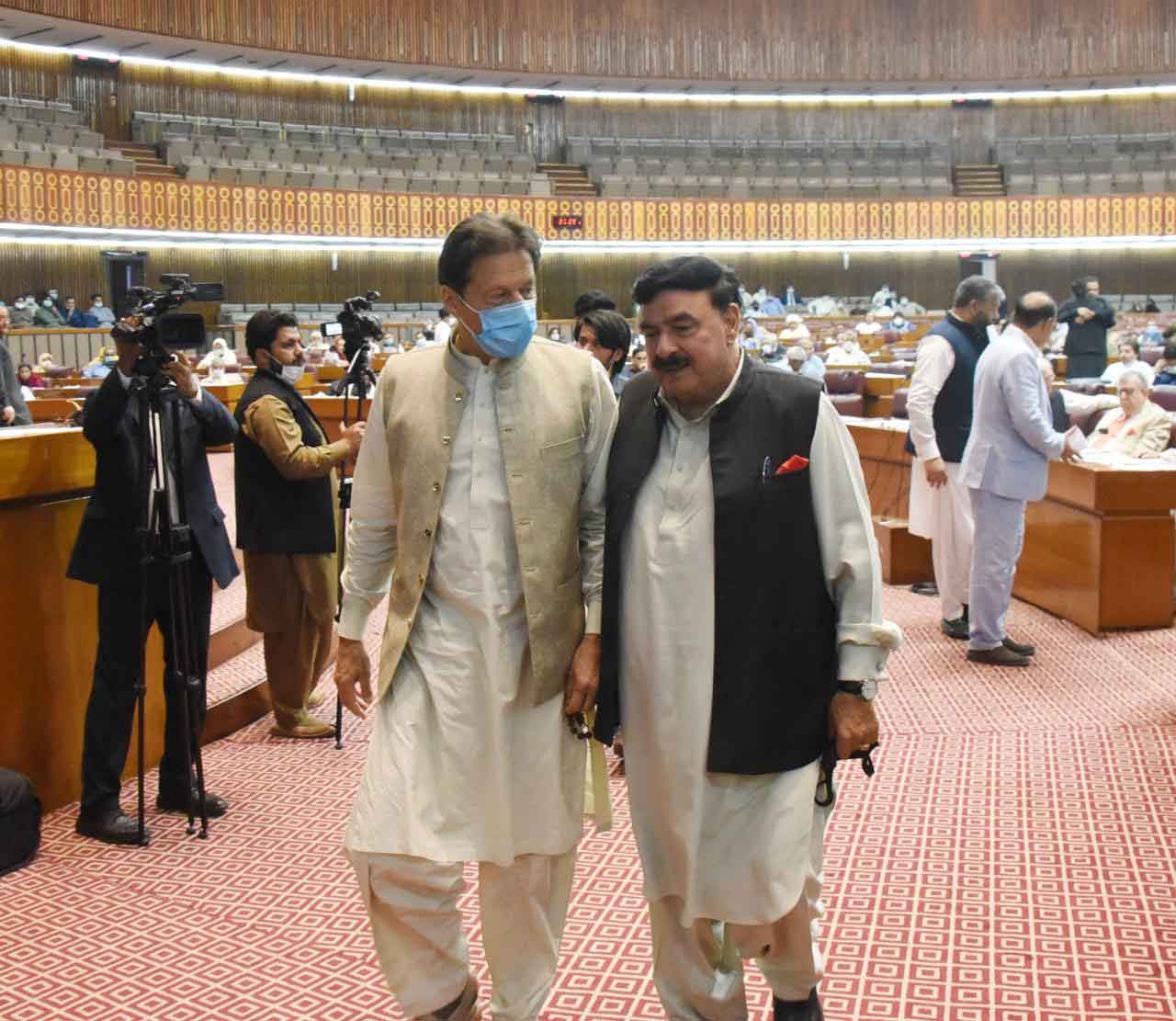 Prime Minister Imran Khan and Minister for Interior Sheikh Rasheed Ahmed leaving the National Assembly after the session was adjourned.