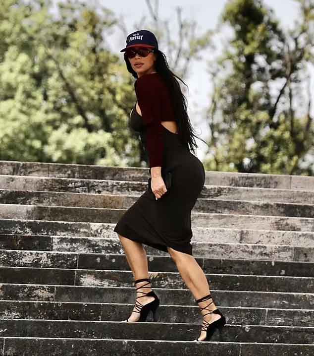 Kim Kardashian wows in plunging black dress as she ventures out of her hotel in Rome